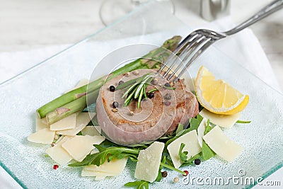 Delicious Beef on arugula salad and parmesan Stock Photo