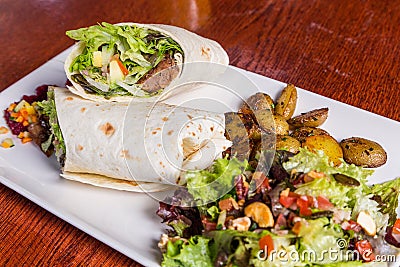 Delicious beef kabab with fresh salad and grilled garlic Stock Photo