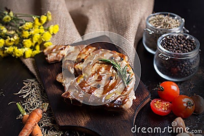 Delicious beef or pock steaks on wooden table. Grilled bbq steaks with fresh vegetable. With the ingredients organic for cooking. Stock Photo