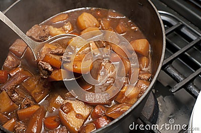 Delicious beef stew cooking in a pot Stock Photo