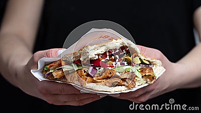 Delicious Berliner doner kebab with fresh turkey and chicken, mixed salad with tomatoes Stock Photo