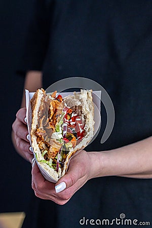Delicious Berliner doner kebab with fresh turkey and chicken, mixed salad with tomatoes Stock Photo