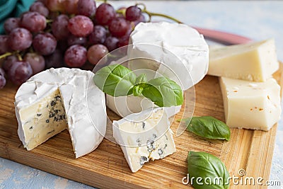 Delicious blue brie blue cheese with grapes Stock Photo