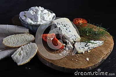 delicious blue cheese on a wooden board Stock Photo