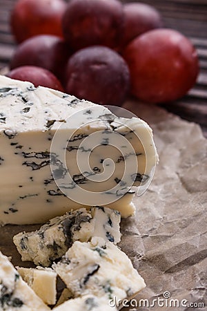 Delicious blue cheese on wooden rustic background Stock Photo