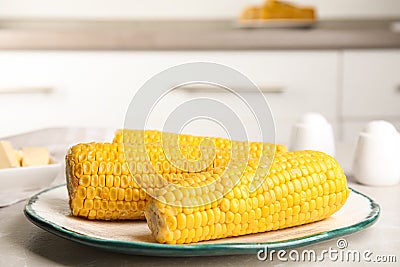 Delicious boiled corn on table in kitchen Stock Photo