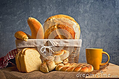 Delicious bread and rolls inwicker basket Stock Photo