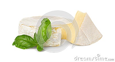 Delicious brie cheese with basil on white background Stock Photo