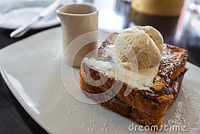 Delicious brioche bread french toast topped with ice cream Stock Photo