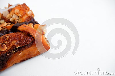 Delicious cake with peanut butter cream layer and chocolate topping. Bakery white background. Selective focus Stock Photo