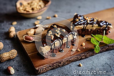 Delicious cake with peanut butter cream and chocolate topping Stock Photo