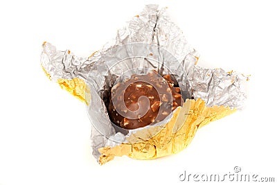 Delicious candy in golden foil Stock Photo