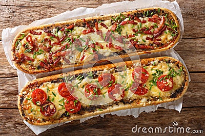 Delicious casserole sandwich with bacon, mushrooms, tomatoes and mozzarella cheese close-up. Horizontal view top Stock Photo