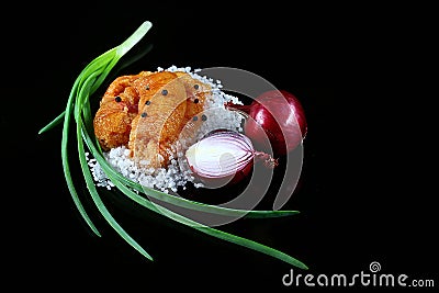 Delicious caviar, roe closeup, pike caviar flat lay on sea white salt, green onions, red hot pepper, purple onion on a black backg Stock Photo