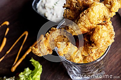 Delicious cheese stringy slice lifted kept on a table baked top view close up Stock Photo