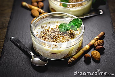 Delicious cheesecake creamy with hazelnut, almond, walnut, and peanut closeup Stock Photo