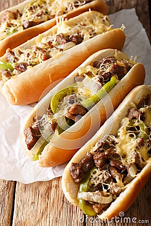 Delicious cheesesteak sandwiches close-up on the table. vertical Stock Photo