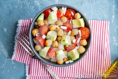 Delicious chickpea salad with cherry tomato, avocado and cucumber Stock Photo