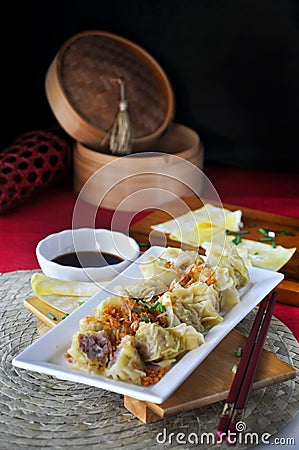 Delicious Chinese appetizer Wanton Serving on White Plate Stock Photo