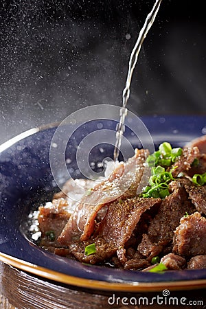 Delicious Chinese cuisine with beef drenched in oil Stock Photo