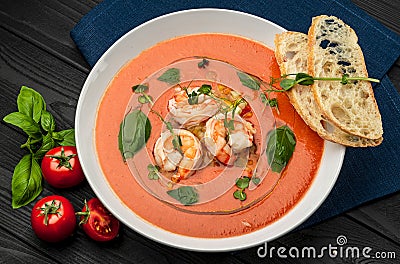 Delicious cold tomato soup or gazpacho with shrimps Stock Photo