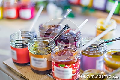 Delicious colorful jam, jelly or confiture in little glass jar Stock Photo