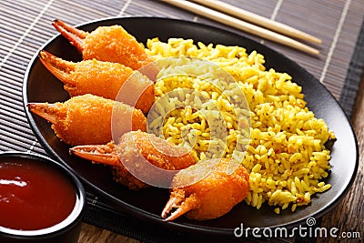 Delicious crab claws in deep fried with a garnish of yellow rice Stock Photo