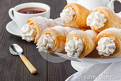 Delicious cream horns filled with vanilla cream Stock Photo
