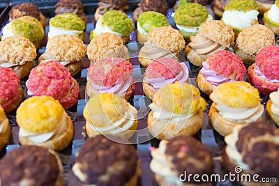 Delicious cream puffs mix background Stock Photo