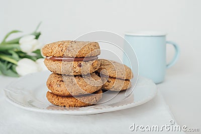 Delicious crumbly sandwich cookies Baci di Dama or Lady kisses with chocolate filling Stock Photo