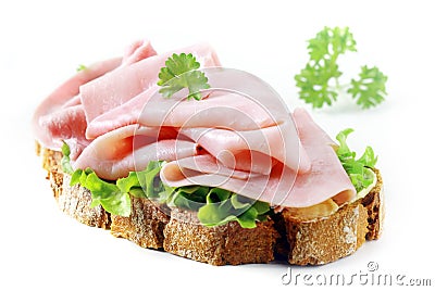 Delicious cured ham slices on rye bread Stock Photo