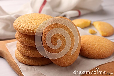Delicious Danish butter cookies on wooden board, closeup Stock Photo