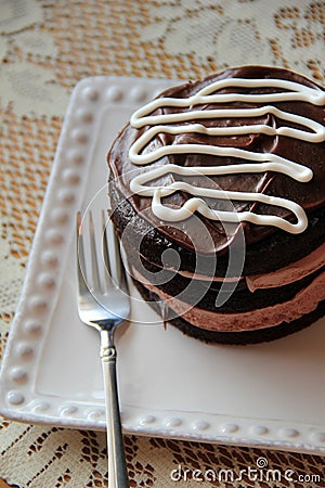 Delicious dessert of dark chocolate cake and thick, creamy frosting Stock Photo