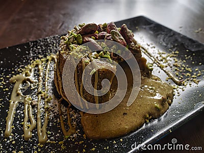 Delicious Dessert pistachio served on a plate. milk puddings and custards Stock Photo