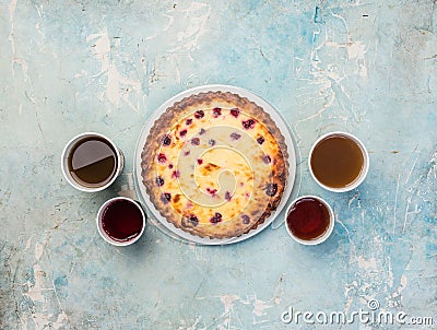 Delicious dessert on a plate with four kinds of tea. Sweet tasty cheesecake with fresh berries. Top view Stock Photo