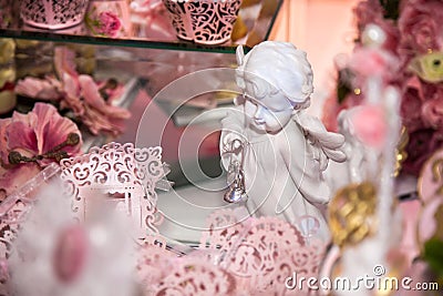 Delicious desserts at the wedding candy bar in the buffet area: statuette, figurine, angels Stock Photo