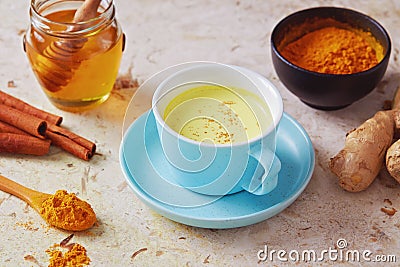 Delicious detox drink made of turmeric, ginger, milk, honey and Stock Photo