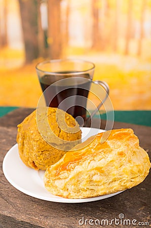 Delicious ecuadorian breakfast, empanada y bolon with dark coffee Stock Photo