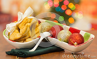 Delicious ecuadorian pristinos piled up in bowl, traditional andean pastry, fruit platter sitting besides Stock Photo