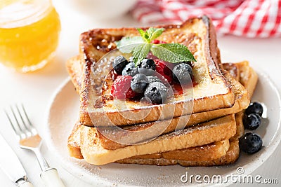 Delicious french toast with berries and honey Stock Photo