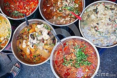 delicious fresh street food in Thailand - top view - Thai Curry, Tamarind, Tom Yam, Shrimp, Pork, Pad Thai Stock Photo