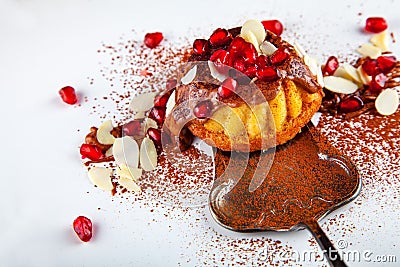 Delicious freshly baked pie with chocolate couverture and almond and pomegranate Stock Photo