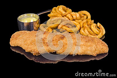 Delicious fried crispy fish fillet with panko garnished with sauce and fried onion rings with reflection Stock Photo