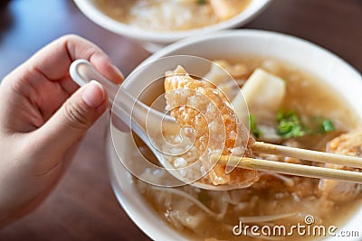 Delicious fried narrow-barred Spanish mackerel fish fillet with rice and noodles in thick soup in Taiwan Stock Photo
