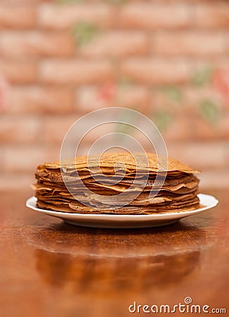 Delicious fried pancakes on wooden table Stock Photo