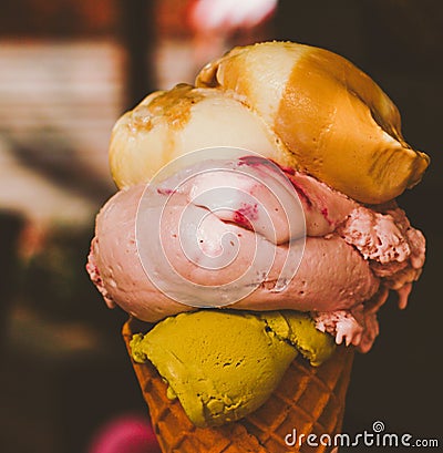 Ice cream cone melting outdoors in summer, sweet dessert food on holiday Stock Photo