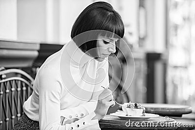Delicious gourmet cake. Girl relax cafe with cake dessert. Excellent taste. Woman attractive elegant brunette eat Stock Photo