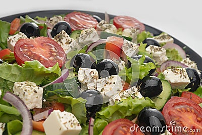 Delicious greek salad on a platter macro frame, close up Stock Photo