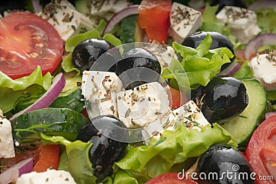 Delicious greek salad on a platter macro frame, close up Stock Photo