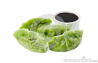 Delicious green dumplings (gyozas) and soy sauce isolated on white Stock Photo